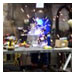 Welder fabricating with torch in custom shop